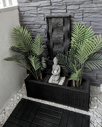 The last but not least piece is an open balcony. Here we can see a spontaneously appearing piece of Bali with a natural stone wall tiles and and outdoor fountain.