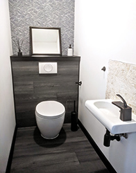 Secondary bathroom is very basic but follows the overall style of the apartment.