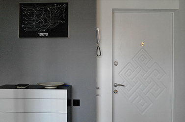 The door has a Tibetan endless knot etched onto it.