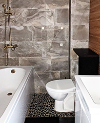 Baia natural stone floor tiles and slate wall tiles to combine with yellow bronze shower.